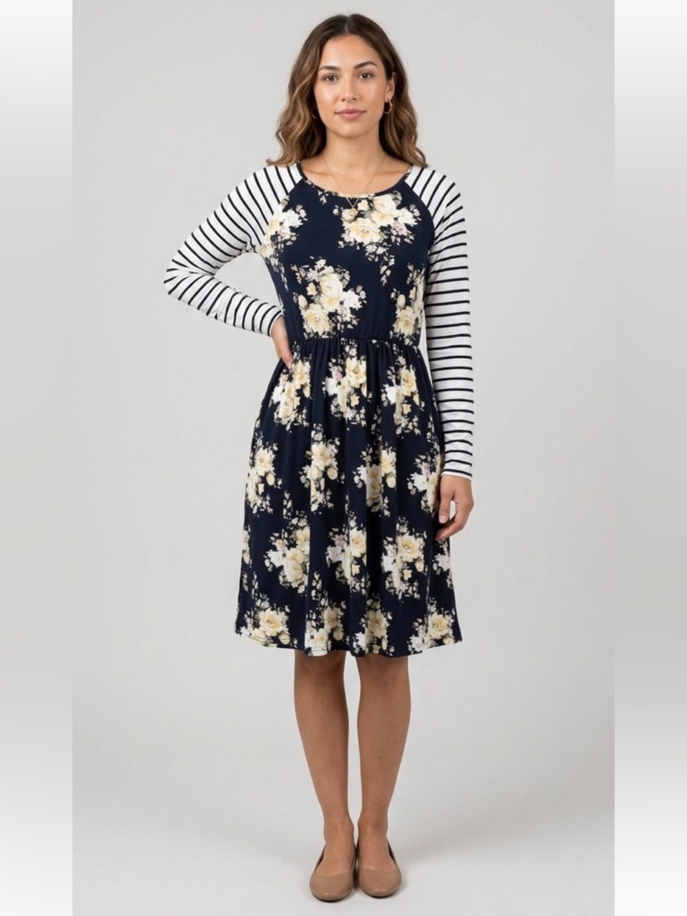 Reborn black floral dress with striped raglan long sleeves.